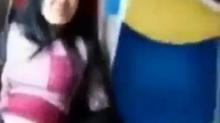 Asian milf rubs her clit on a train.