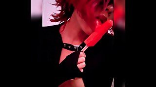 Goth babe licking & sucking red blowpop