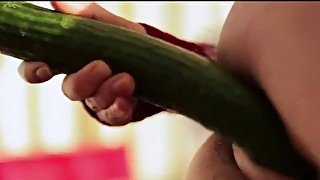 Babe orgasms while using cucumber