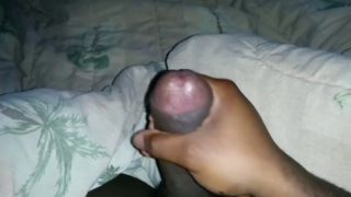 Stroking intensely his fat black dong until cumming hard