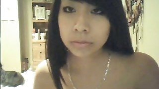 Attractive Asian babe shows me her small and perky tits on webcam