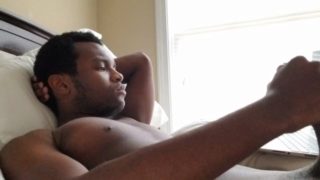 TEEN GUY STROKES HIS BLACK COCK WHILE WATCHING PORN