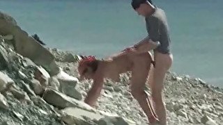 Chubby nudist is getting banged brutally in a doggy position on a beach