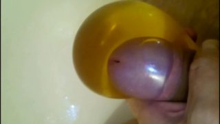 Pissing into a condom