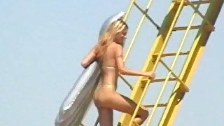 Sexy blonde doll is dancing dirty wearing tiny bikini