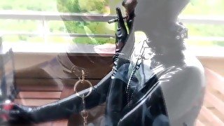 All Rubber Slut Has An Exciting Afternoon with Smoking, Sucking & Toys