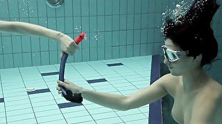 Girls swimming underwater and enjoying eachother