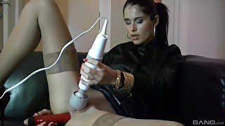 Solo beauty uses huge vibrator on pussy and over the clit