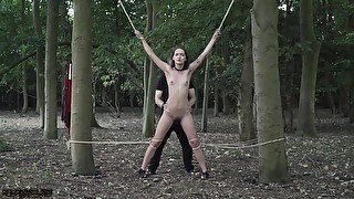 Sexy slave tied up to a tree and tortured