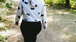 Exhibitionist Milf flashing her round booty and playing with her pussy at a public park