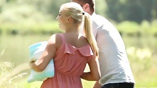 Sexy blonde girl and her man make love outdoors