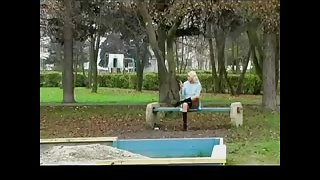 Spying Girl On Phone on Public Garden