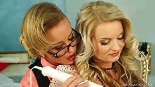 Two mature blond lesbians arouse each other's pussies with vibrator