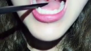Chinese girl uvula (was she swallowing with her open mouth at 0:56?)