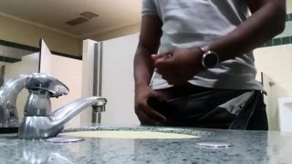 Black perv caught jerking in restroom