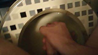 Horny guy jerking and cumming in toilet