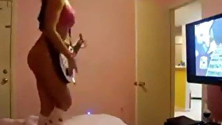 Chick plays Guitar Hero in her underwear