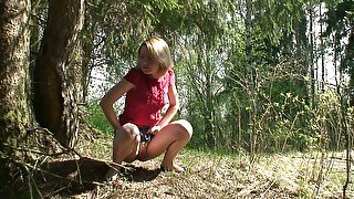 Hot blonde young chick from Russia pissed under the tree