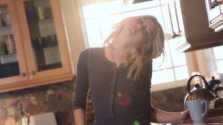 Tattooed blonde babe masturbates in the kitchen solo