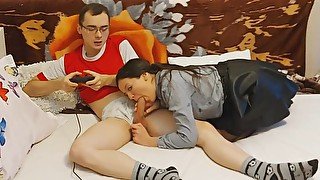 Hot schoolgirl seduces her nerdy classmate while he's playing the playstation