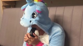 Girl in unicorn onesie gagging on dildo