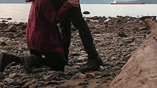 Asian teen gives blowjob and flashes on public beach