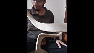 Video of model in chair peeing hardly