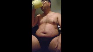 Chubby gainer drinking a gainer shake