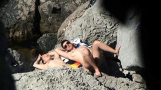 Beach voyeur finds a lovely amateur babe enjoying the sun