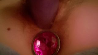 Tiny pussy is pummelled by dildo while butt plug stimulates anal pleasure