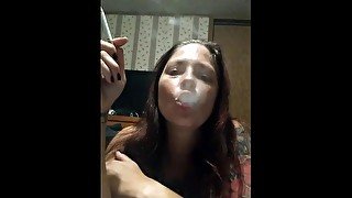 Hot babe smoking and sucking on these perfect big tits making my pussy wet for you