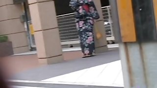 Black-haired small geisha flashes her tits when someone pulls her outfit