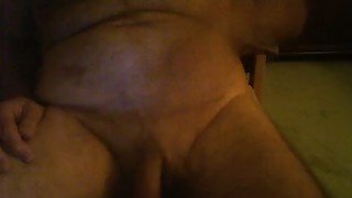 A chubby hairy guy on webcam beats off and cums in the glass