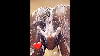 Slim-thick darkskin goddess twerks and spreads pussy in shower