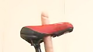 Super Horny Japanese Babe Reaches Orgasm Riding a Sybian Bicycle