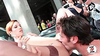 Pierced porn chick fucks for a big public audience