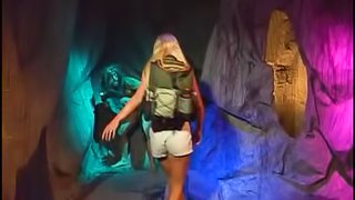 Bridgette Kerkove seduces a couple of men for a threesome in a cave