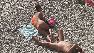 Sweet girlfriend and her man were sunbathing nude on the beach