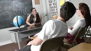 Full-bosomed lady teaches schoolgirl how to give a footjob