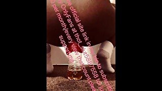 Ebony fucks a bottle filled with piss deep in her prolapsed anus