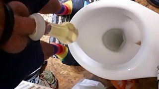 Having fun pissing in condom