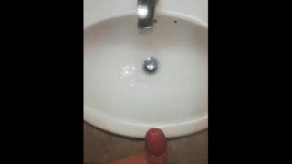 Huge piss in hotel bathroom and huge cumshot