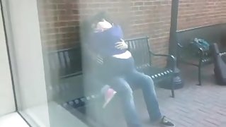 Students humping on a bench in public