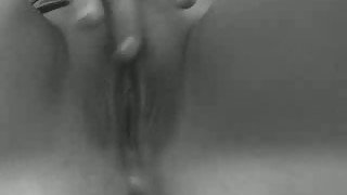 Horny wife of mine diddles her tight shaved pussy with her middle finger