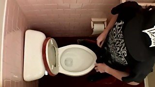 Devin Reynolds grabs his cock and unloads in the toilet