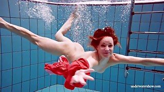 Sexy naked twat Avenna swims nude in the pool