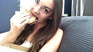 Sexy babe eating a burger