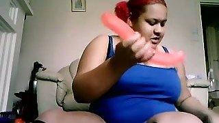 BBW girl with red hair poking her snatch with dildo