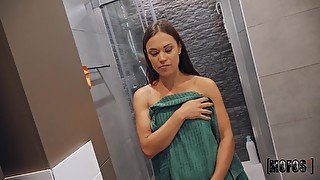 Dark-haired babe opens ass to get anal orgasm in bathroom