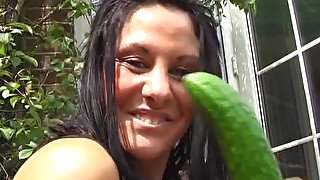 Naughty babe Crystel Lei drills her pussy with a big cucumber